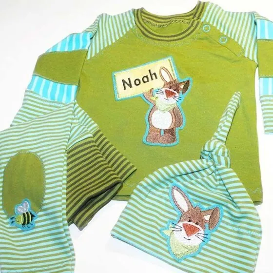Rabbit embroidery design: KULIO with appliqué sign on sweater