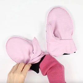 Instructions for free mittens sewing pattern: insert cuffs bewteen outer mitten and lining, step 1