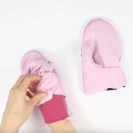 Instructions for free mittens sewing pattern: insert cuffs bewteen outer mitten and lining, step 2