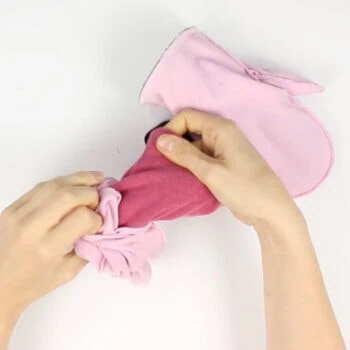 Instructions for free mittens sewing pattern: turn the cuffs through the opening in the lining