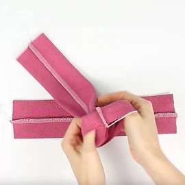 Instructions for free mittens sewing pattern: fold cuff tubes in half, step 1