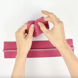 Instructions for free mittens sewing pattern: fold cuff tubes in half, step 2