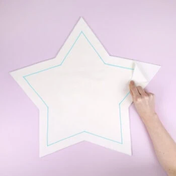 How to sew a star pillow using our free template: pin the fabric pieces together