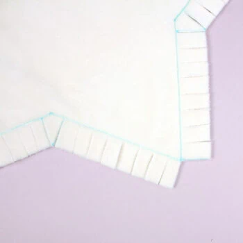 How to sew a star pillow using our free template: cut fringes