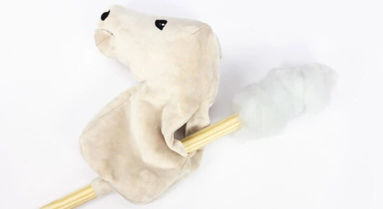 Make a Hobby Horse: How to attach the stick to a Hobby Horse: Insert the stick with the batting plug